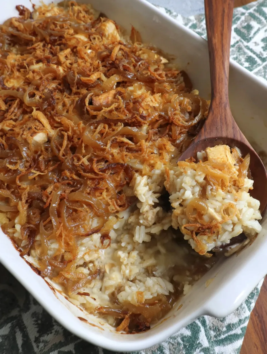 A bowl stacked with cheesy French onion chicken and rice goodness.