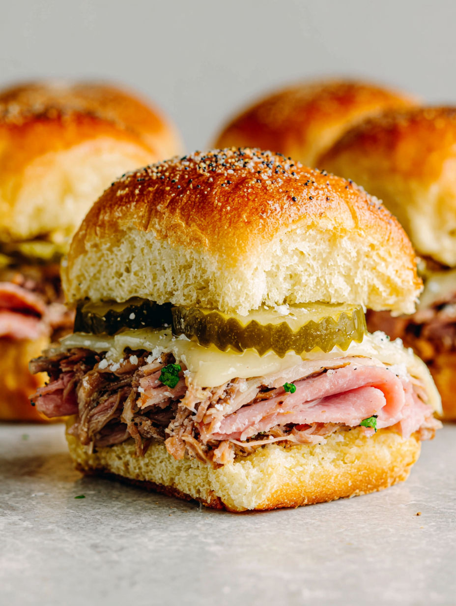 A close up of a Cuban sandwich with pickles and cheese.