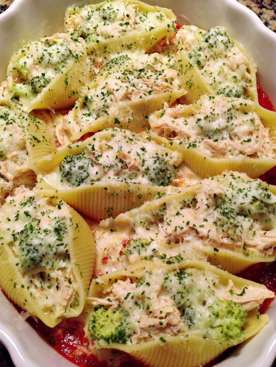 A plate of food with pasta and chicken.
