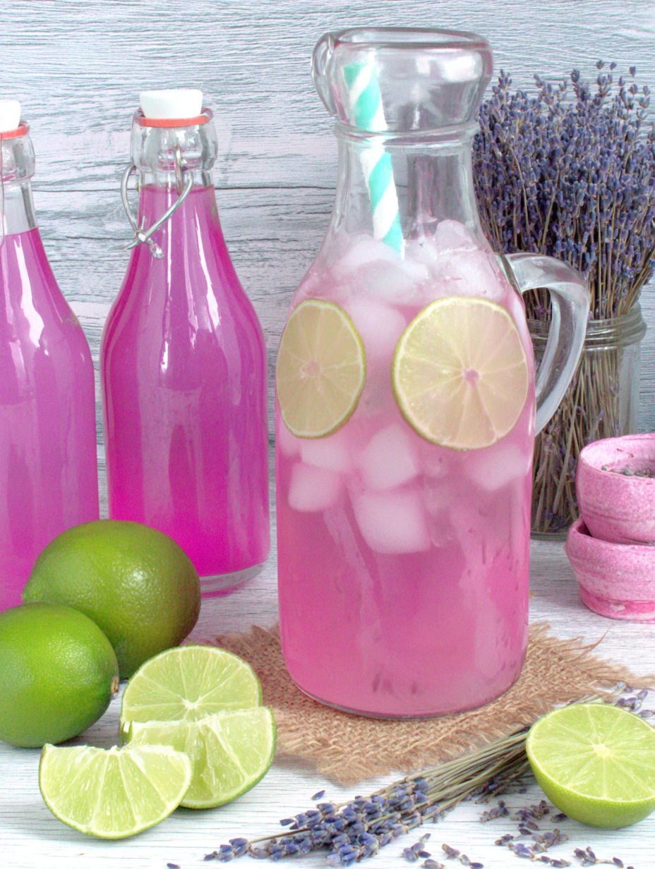 A pink drink with lemon slices in it.