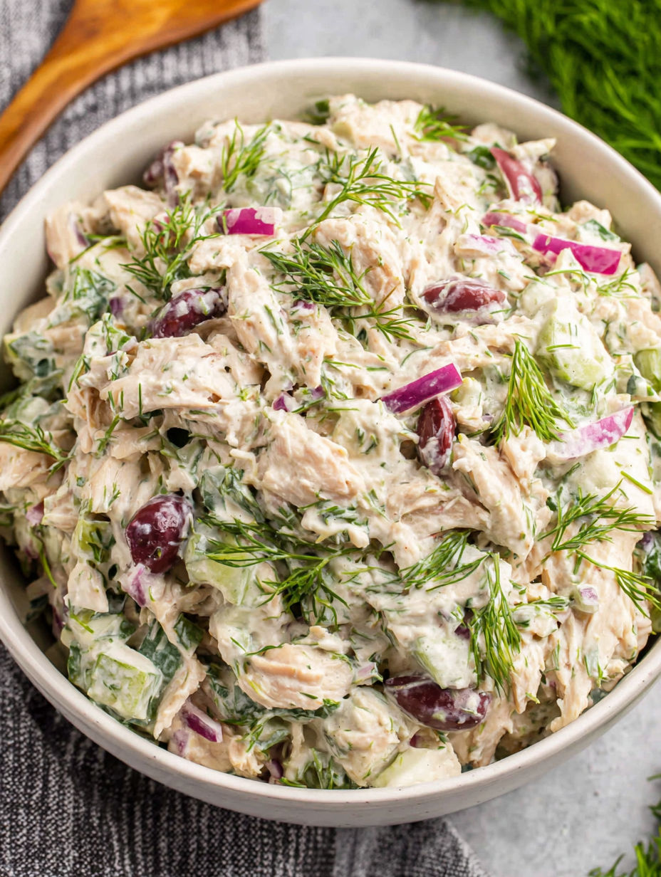 A bowl of a colorful dish filled with various vegetables and meat.