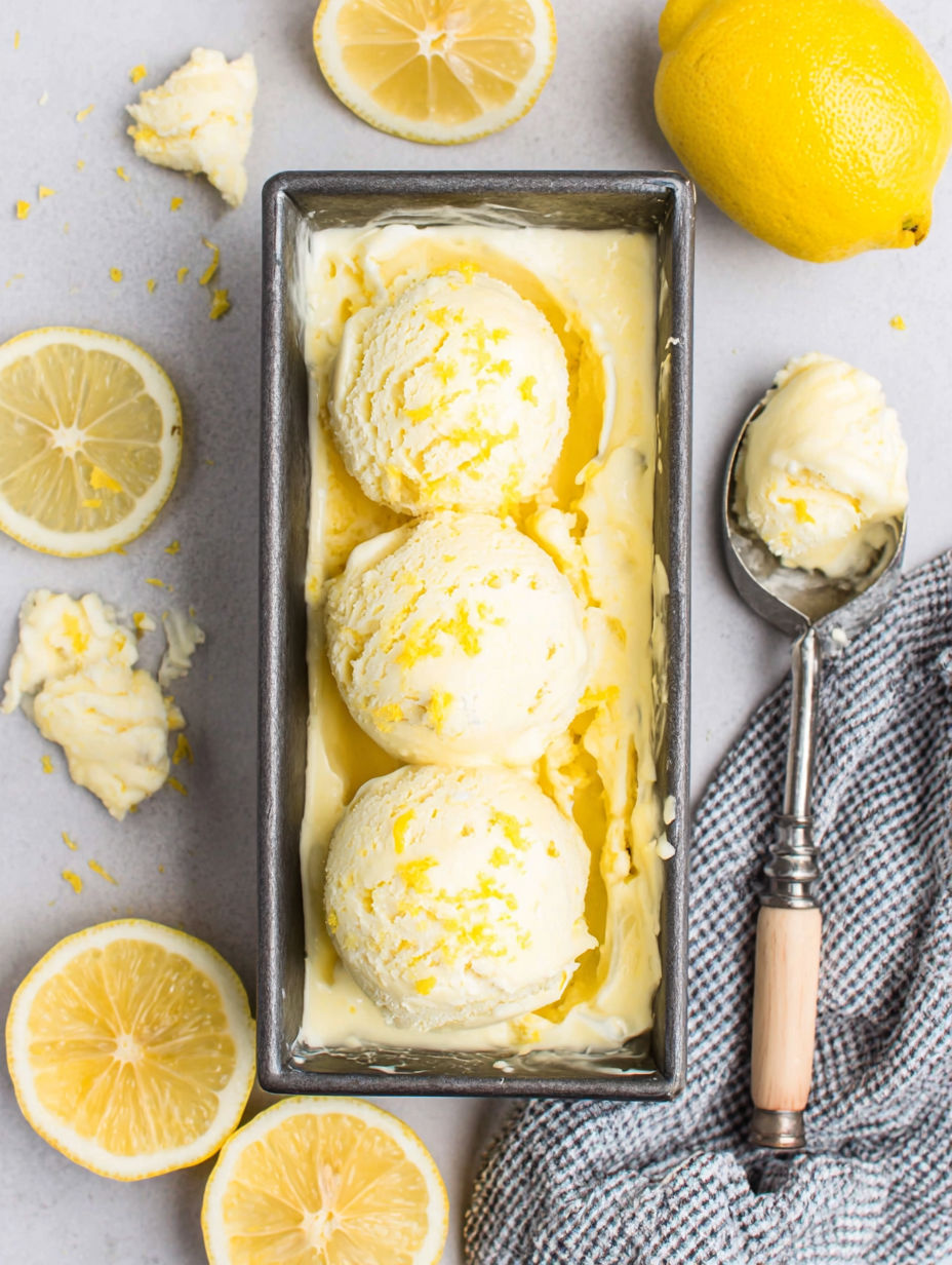 A bowl of lemon ice cream with a spoon in it.