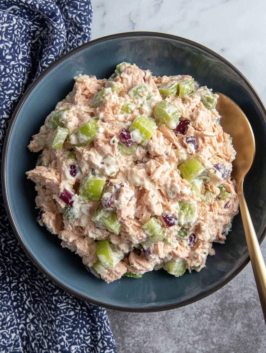 A bowl of food with a spoon in it.