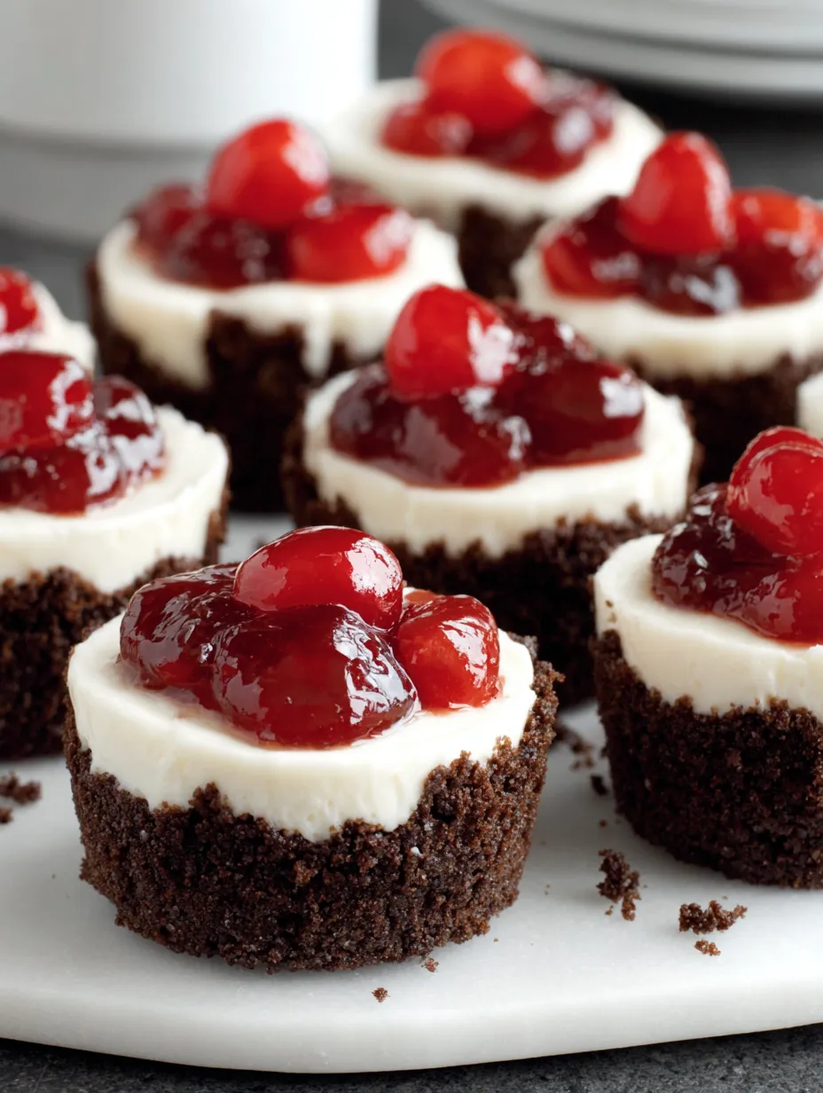 Mini cheesecakes with cherries on top.