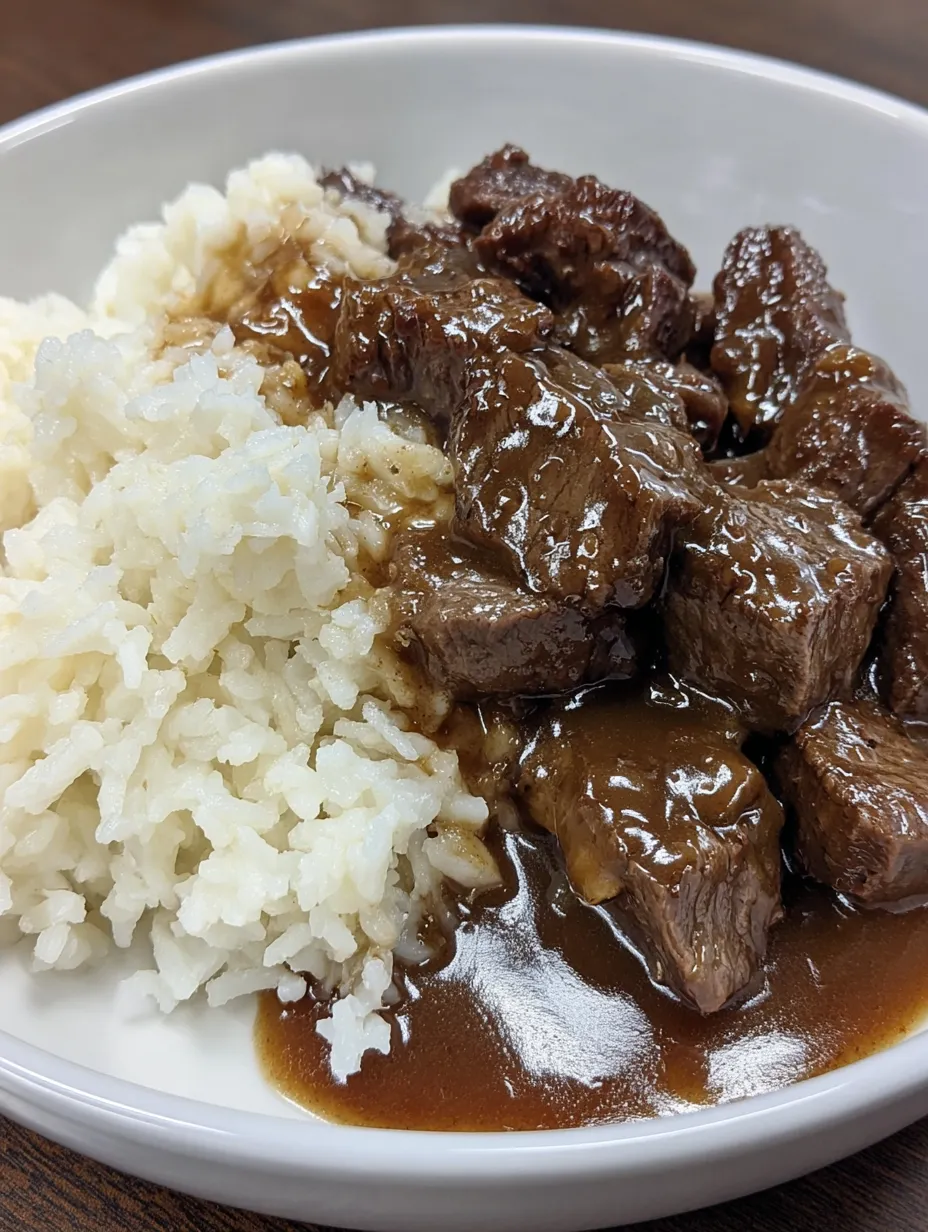 A bowl of beef tips and gravy.