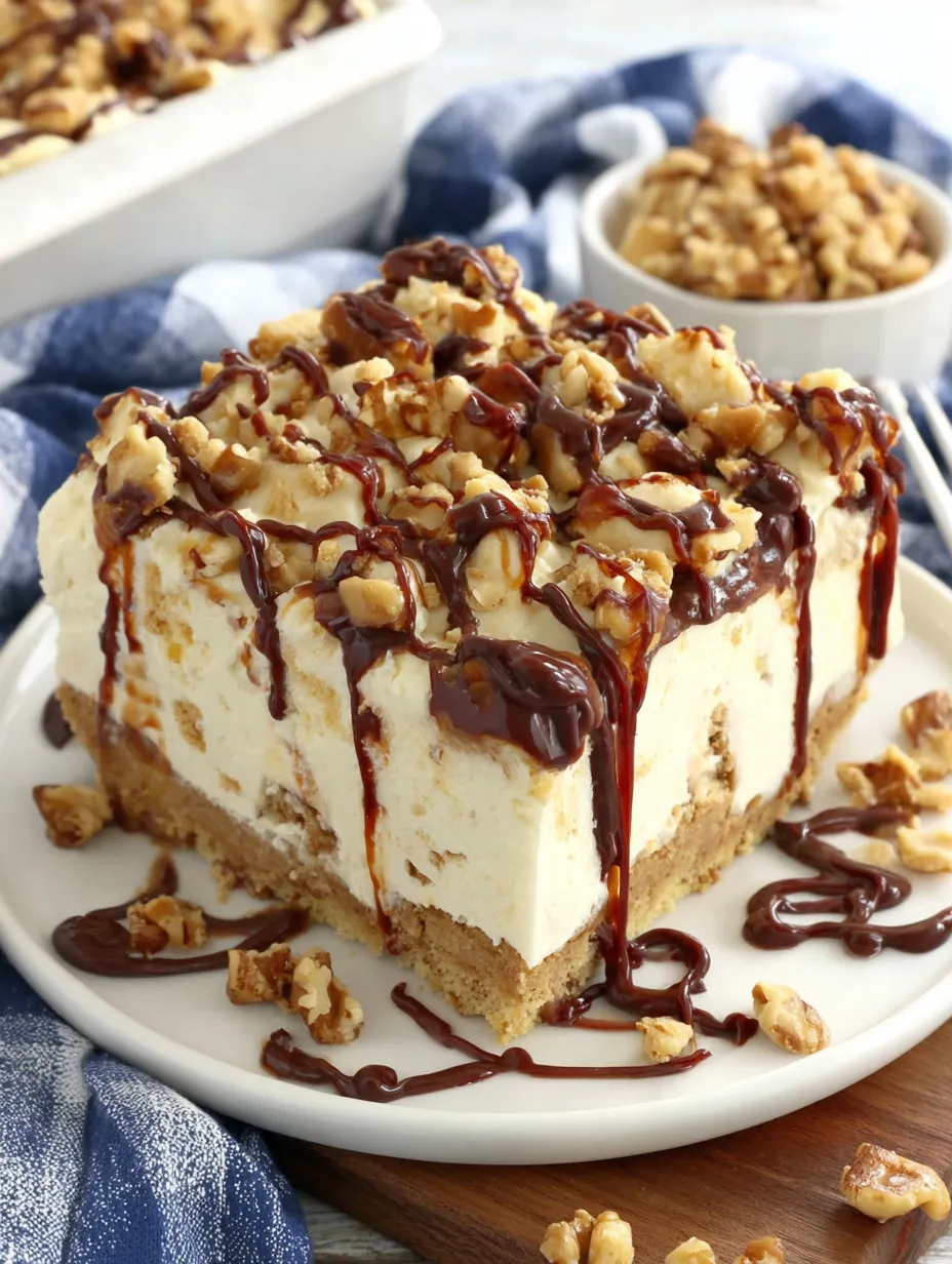 A piece of cake with chocolate drizzled on top.