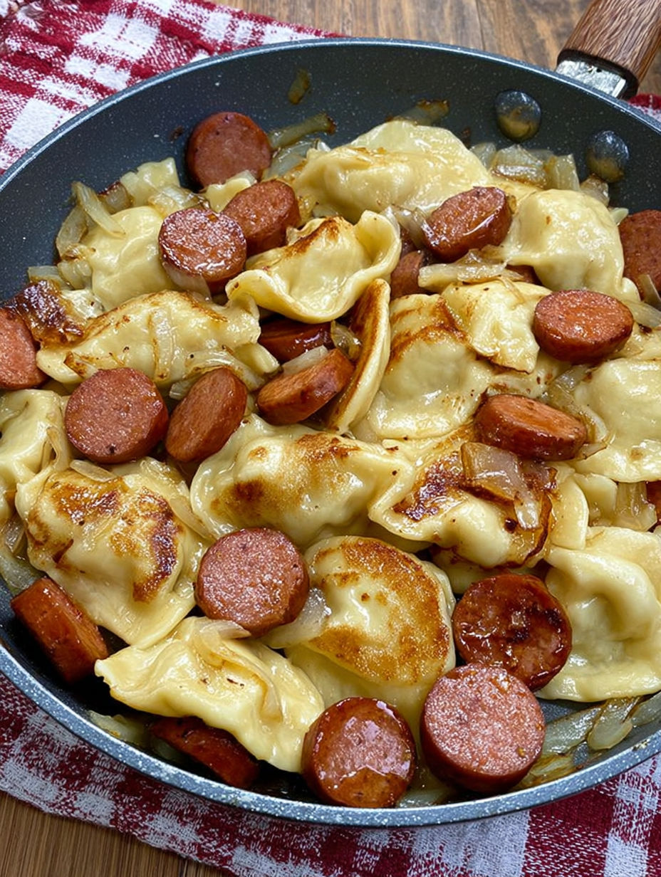 A plate of food with sausage and noodles.
