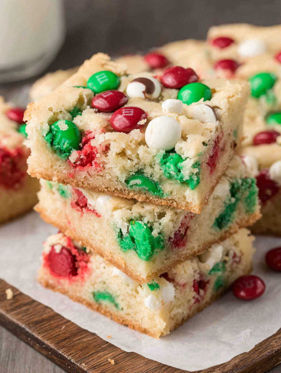 A stack of cake with red, green and white icing.