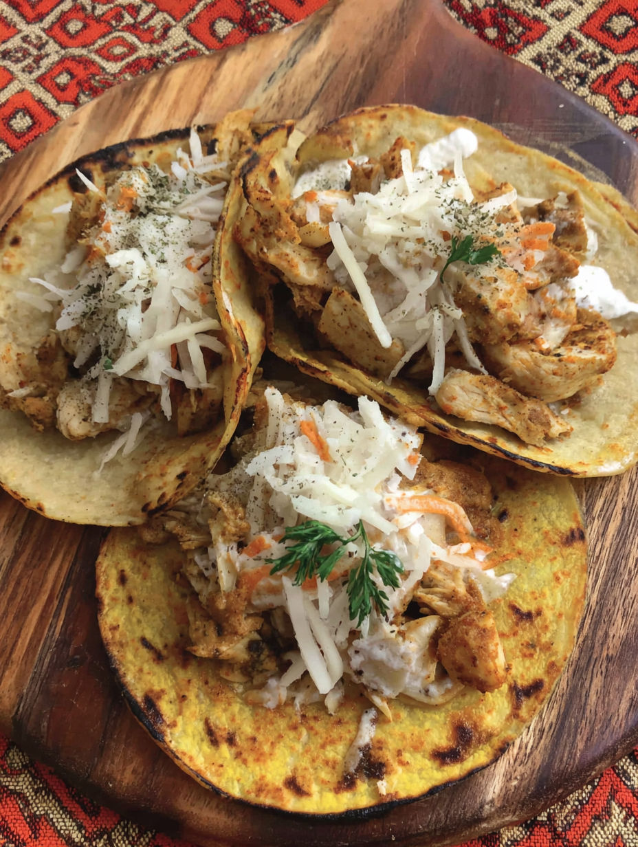 A plate of tacos with meat and vegetables.