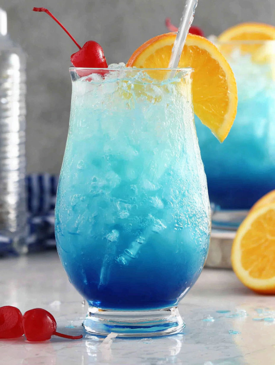 A blue drink with a straw in it.