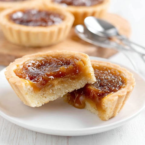 Two pieces of a keto butter tart.