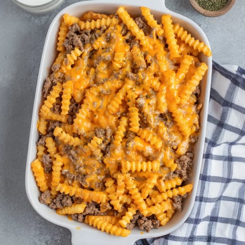 A cozy white dish filled with crispy fry bake.