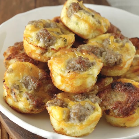 Plate filled with mini sausage bites.