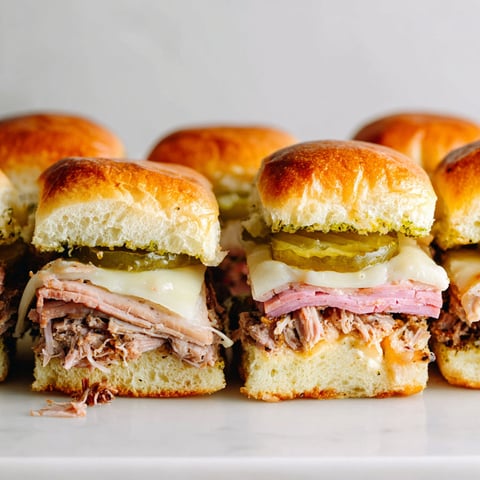 Cuban sliders on a white plate.