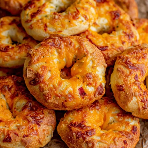 A pile of cheese bagels.