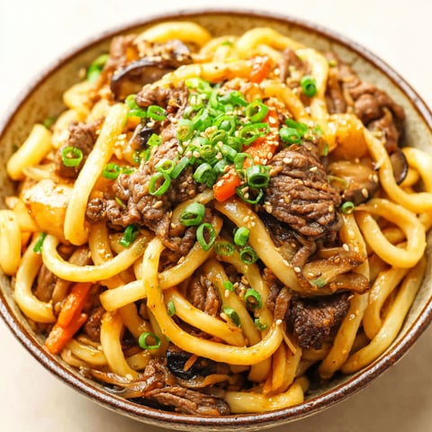 A bowl of beef and vegetable stir fry.