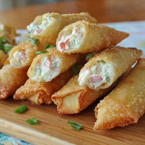 A stack of crab rangoon egg rolls.
