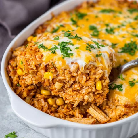 A white bowl filled with a rice casserole.