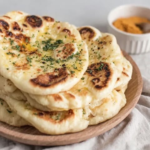 A plate of garlic naan bread.