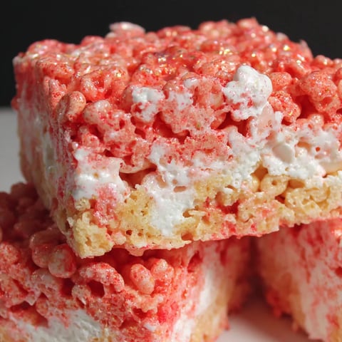 A close up of a red and white dessert.