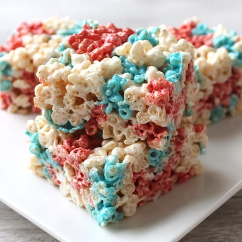 A colorful rice krispie treat on a plate.