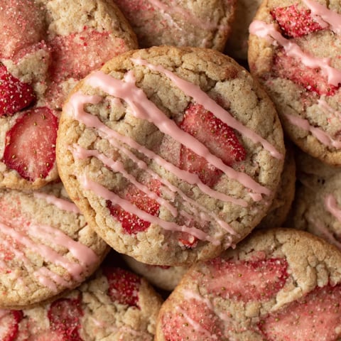 A pile of strawberry iced oatmeal cookies.
