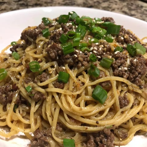 A plate of Mongolian ground beef and noodles.