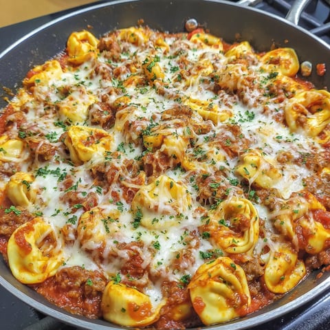 A delicious cheesy sausage tortellini dish.