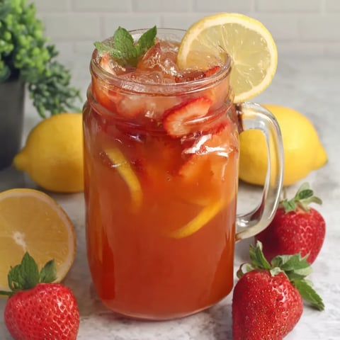 A glass of homemade strawberry lemonade.