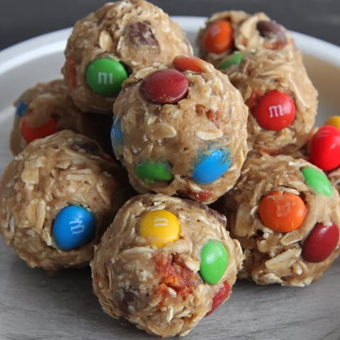 A plate of no-bake energy bites with M&M's and marshmallows.