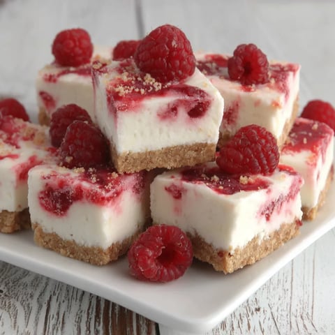 A plate of frozen raspberry yogurt bites.