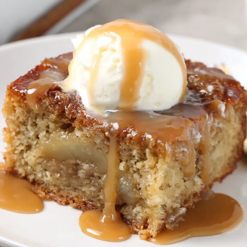 A slice of sticky banana bread pudding cake.