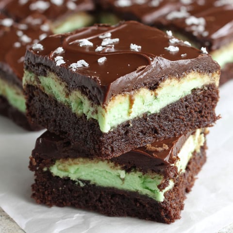A close up of a chocolate mint brownie.