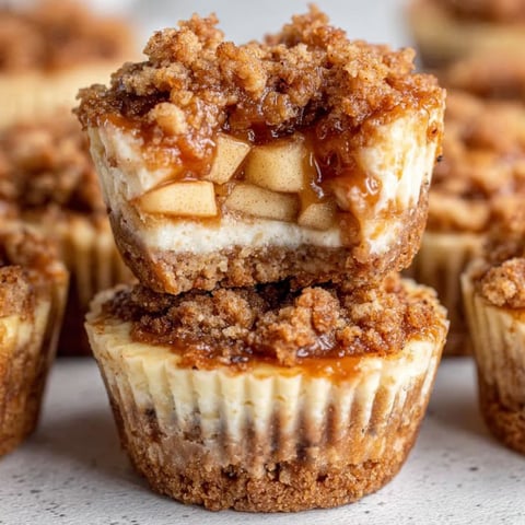 A close up of a dessert with apple crisp cheesecake bites.