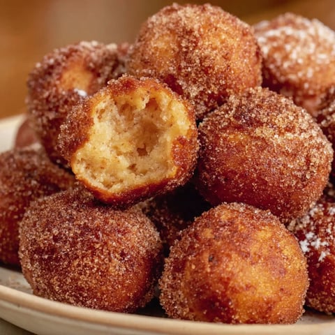 A plate of donuts with a hole in the center.