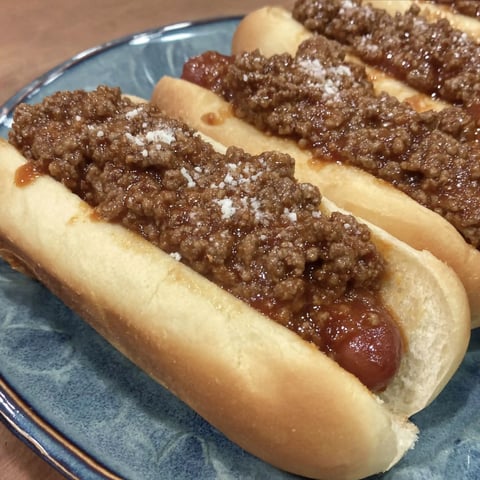 A hot dog with chili on it.