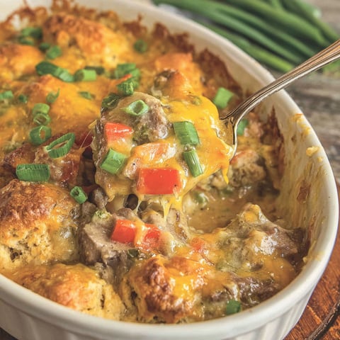 A close up of a delicious Cheddar Bay Philly Cheese Steak Cobbler.