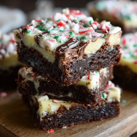 A stack of dark chocolate peppermint bark brownies.