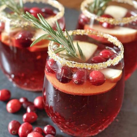 Two glasses of cranberry apple spritzer.