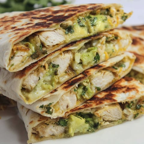 A stack of chicken burritos.