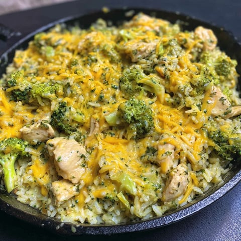 A delicious meal of chicken, rice, and broccoli.