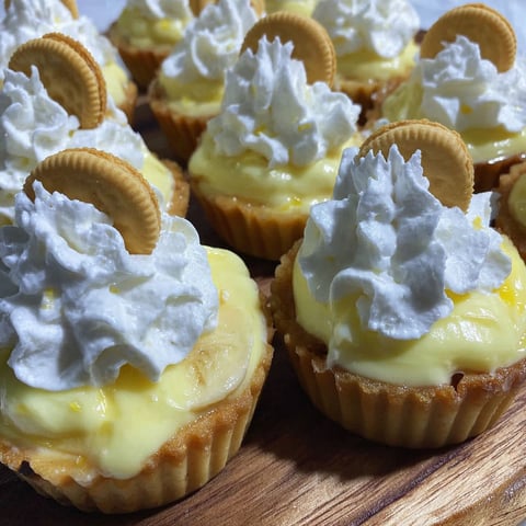 Banana cream pies with white whipped cream.