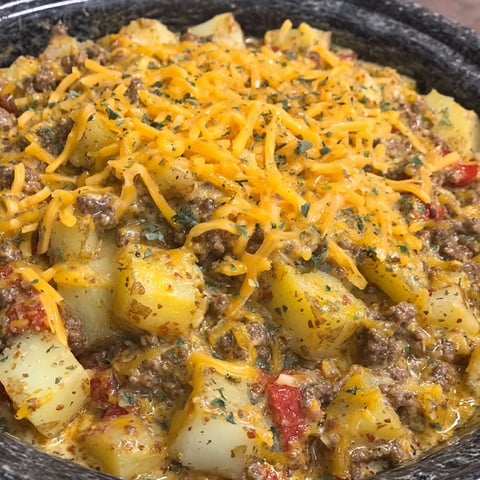 A close up of a crockpot cheesy taco potatoes recipe.
